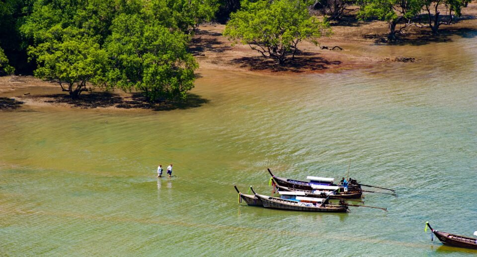Tourists on their way to the Tourist Boat on East Railay Beach, South Thailand, Southeast Asia